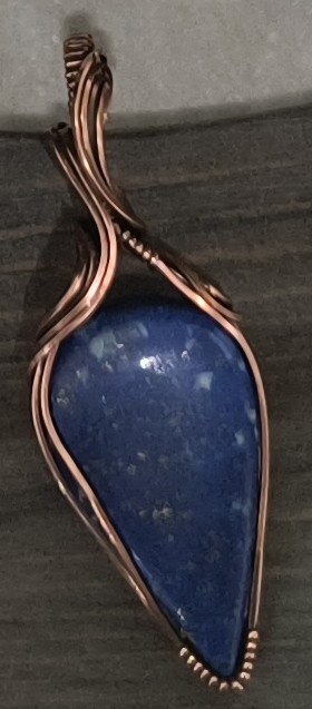 Product Description: Wire Wrapped Pendants by Michelle Huster</br></br>Lapis Lazuli- Antique Copper</br></br>Septarian - Copper</br></br>Square Rainbow MoonStone - Copper</br></br>Rhodochrosite - Sterling Silver (3)</br> Pendants and Necklaces